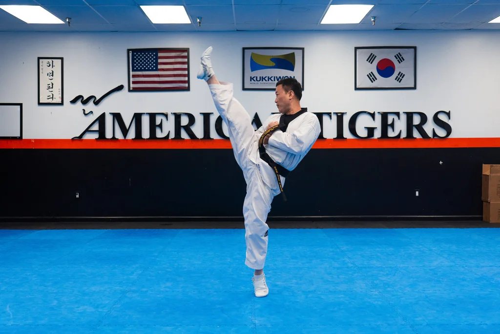 Master instructor demonstrating kick technique